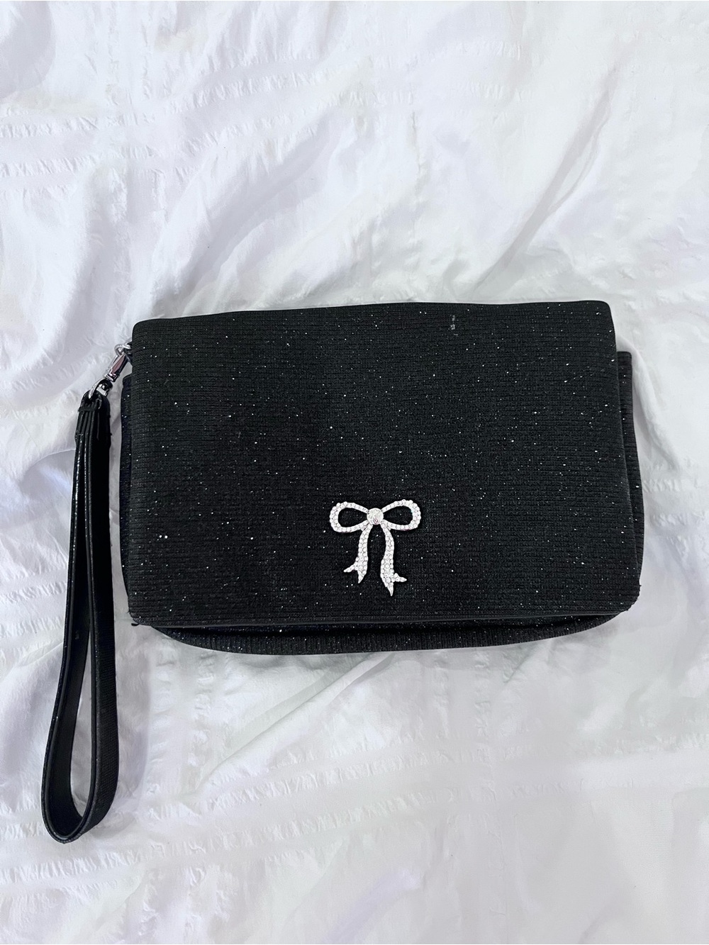 Vs black glittery clutch with silver bedazzle bow detail